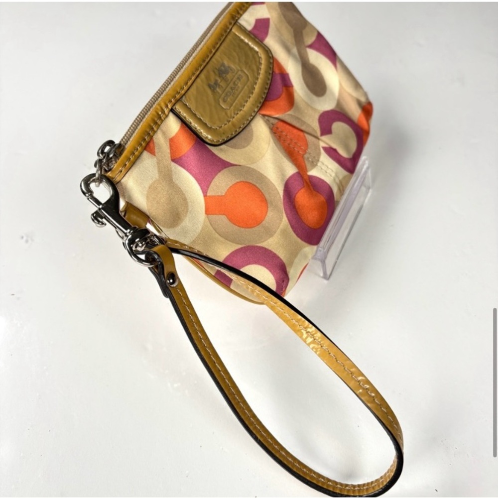Coach Optic C Colorful Patterned Wristlet
Orange pink cream. Patent Leather - Picture 9 of 11
